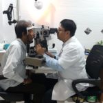 Dr. Sandeep Pal Bansal checking an eye patient during a free eye check up camp at Pal Hospital Eyetec Clinics & The Children Centre