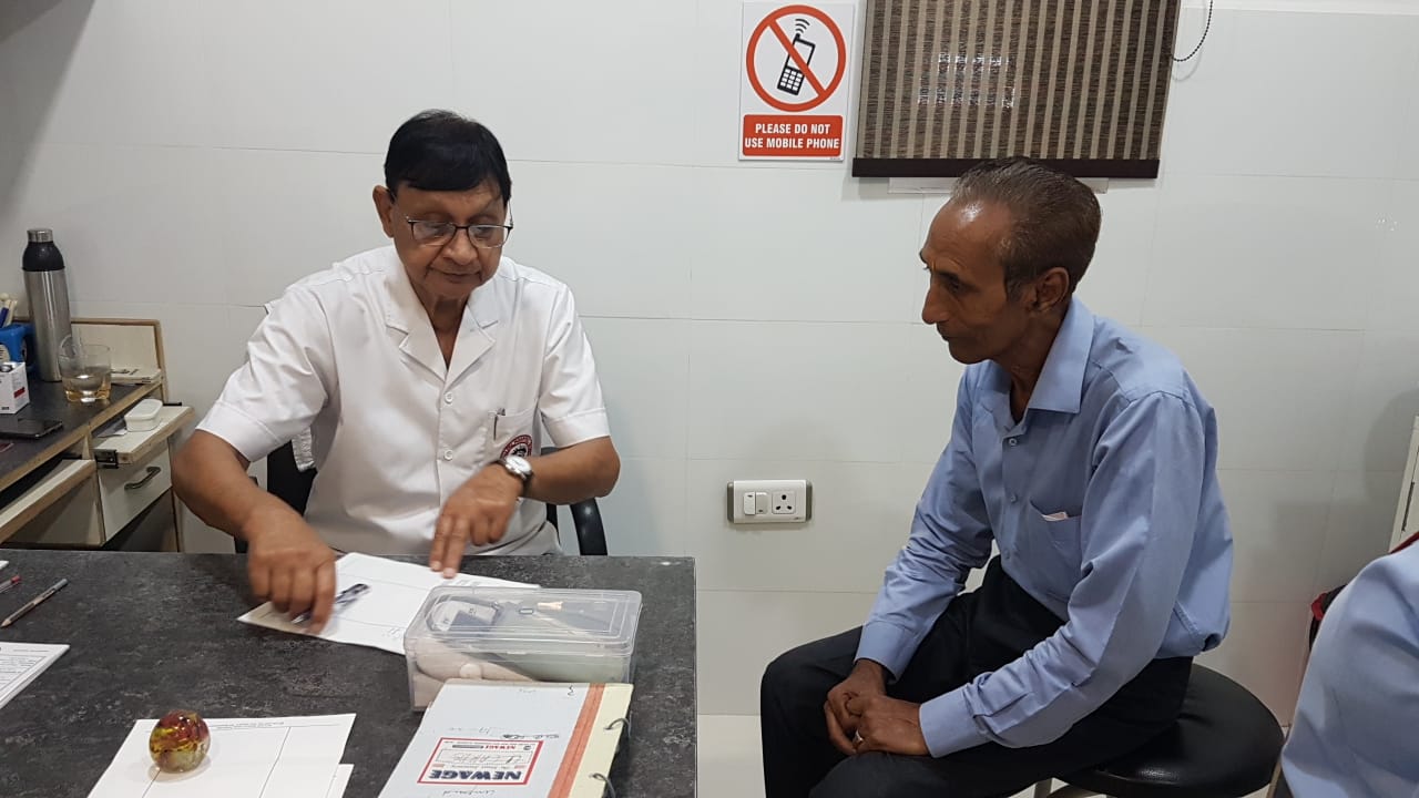 Dr. Dharam Pal bansal checking the piles patient at Pal Hospital Eyetec Clinics & The Children Centre